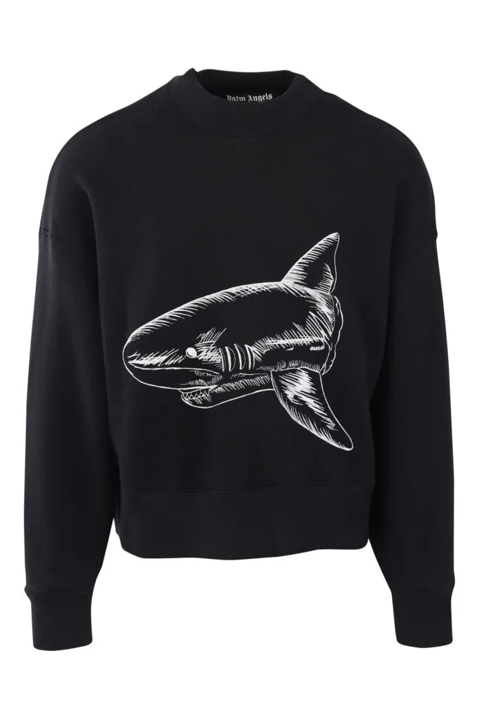Sudadera negra con tiburón bordado blanco y logo detrás